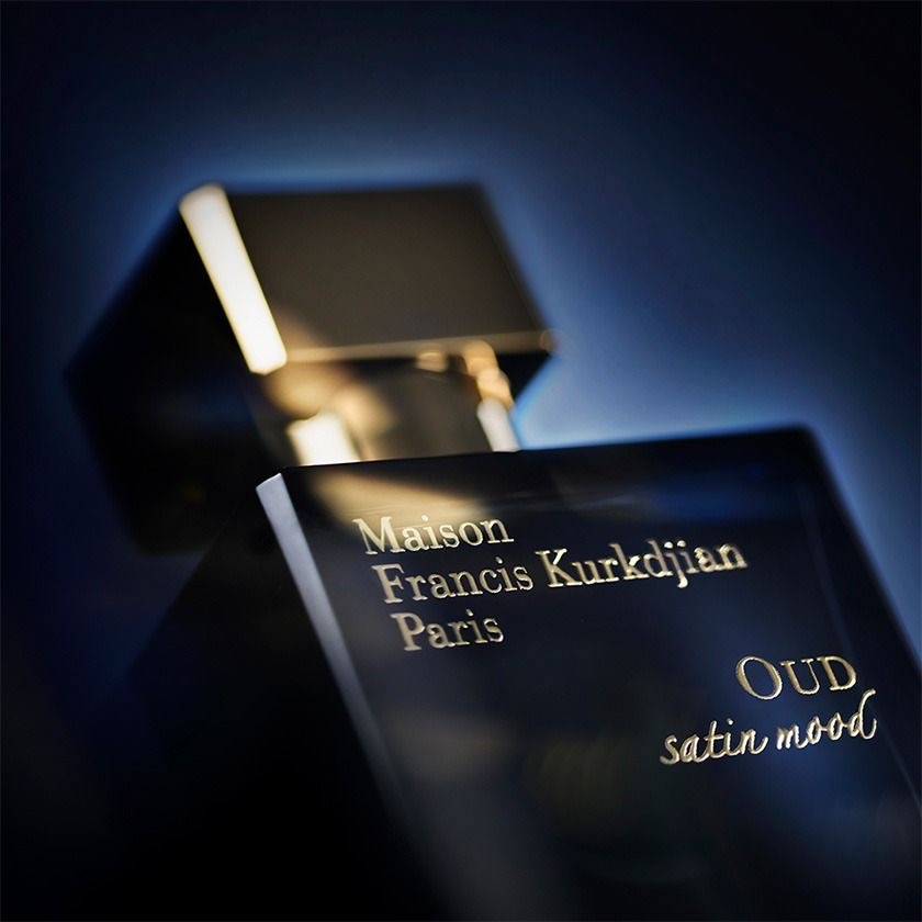 Golden fragrance bottle with botanical details